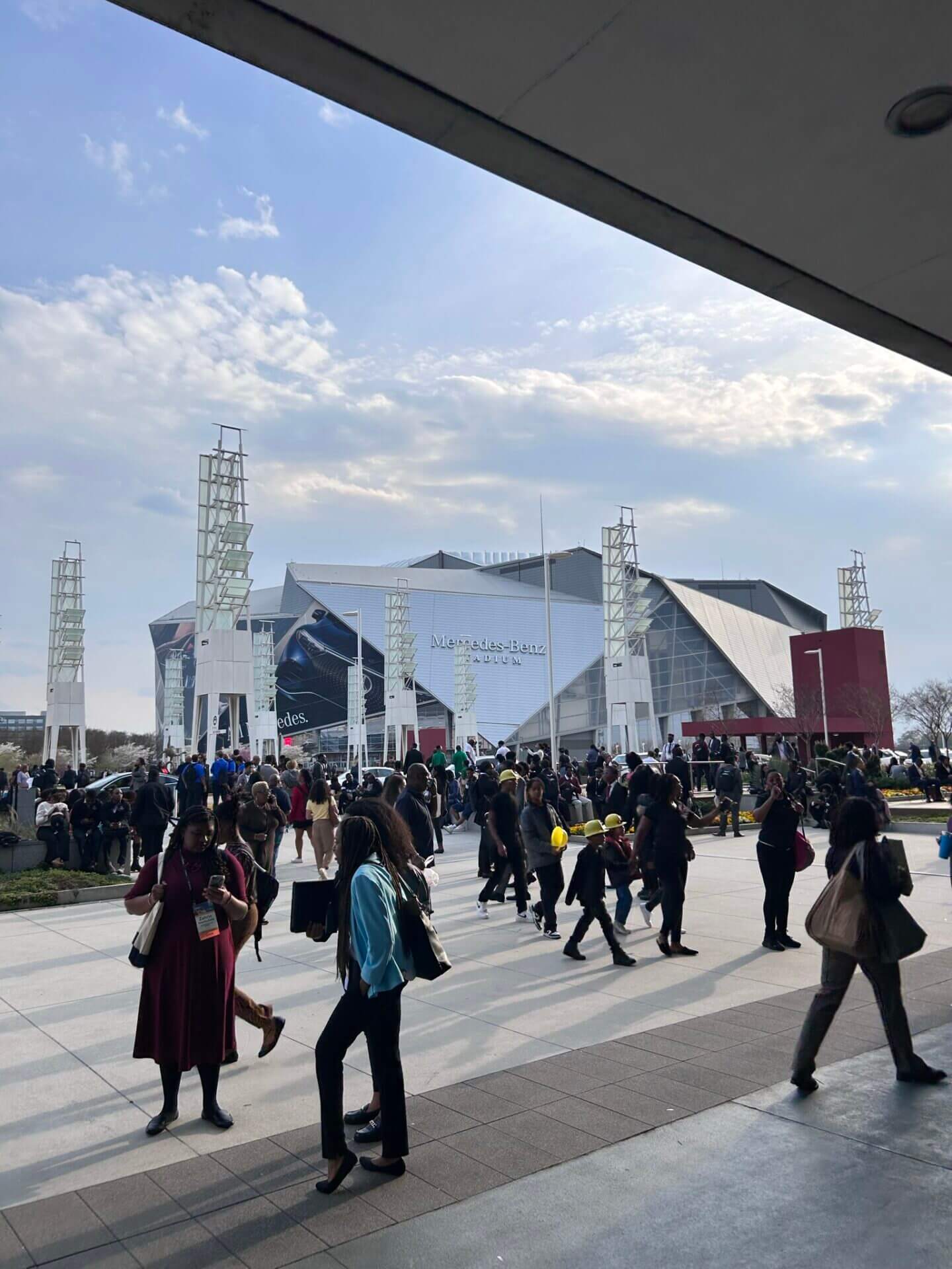 Blue Skies with full clouds, and the Mercedes Center just outside the NSBE venue.